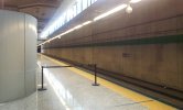 Example from a station in Madrid, Spain(Symbolic fencing to mark the platform end (retractable belt)