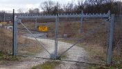 Example of a better gate locking system(It uses a thick latch and the lock it encapsulated into a metal box, which makes is more difficult to be broken